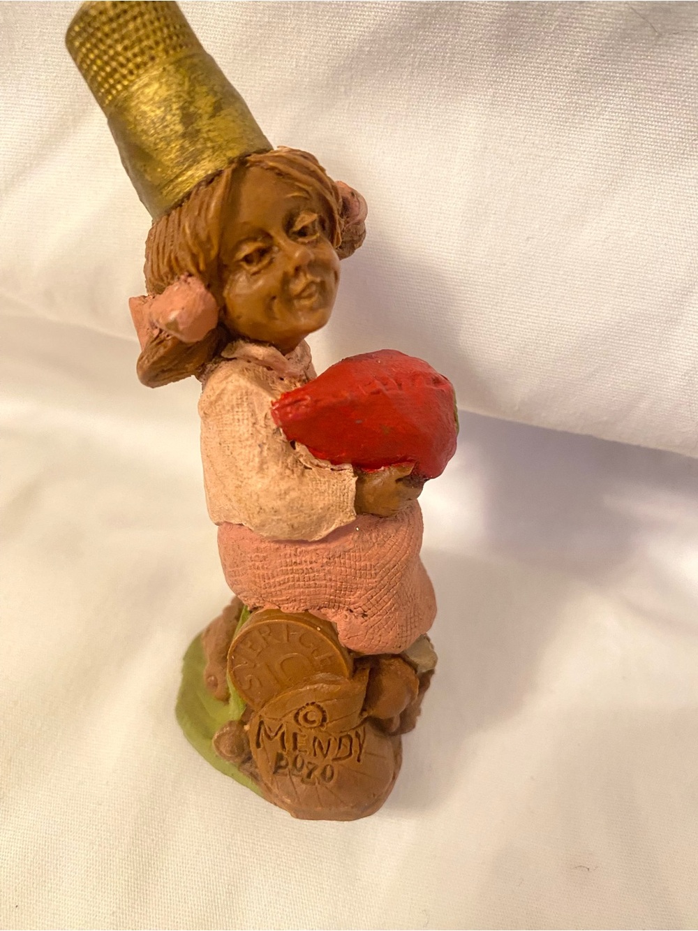 Clarks figurine with red heart and pink accents